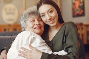 Old woman in a cafe with young granddaughter